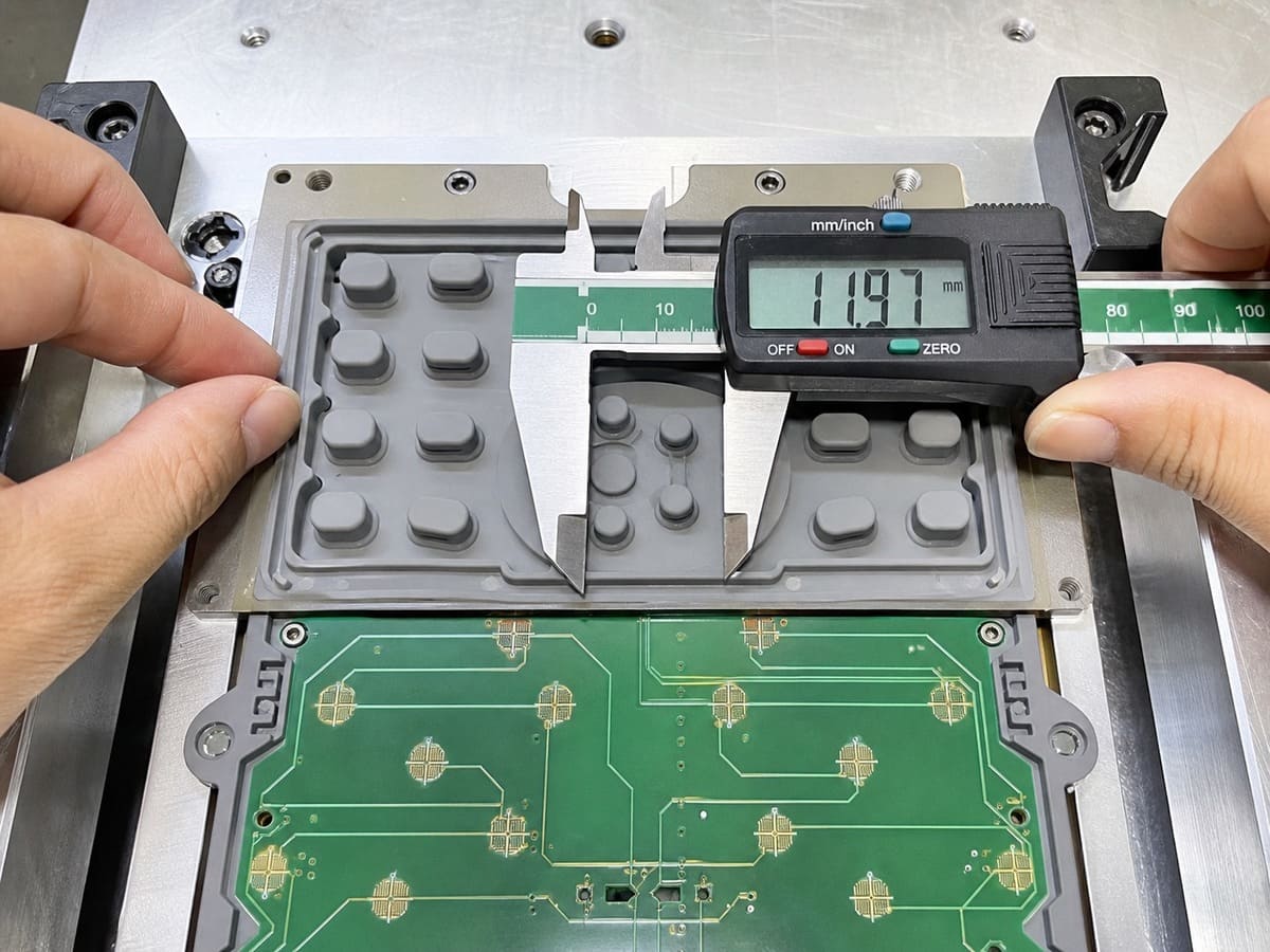 Silicone button dimensional accuracy and assembly fit
