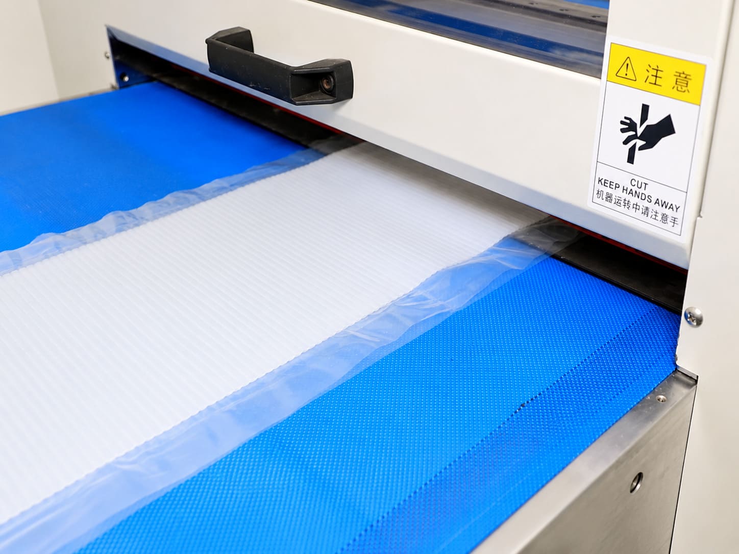 Raw material inspection -- IQC technician testing incoming silicone materials
